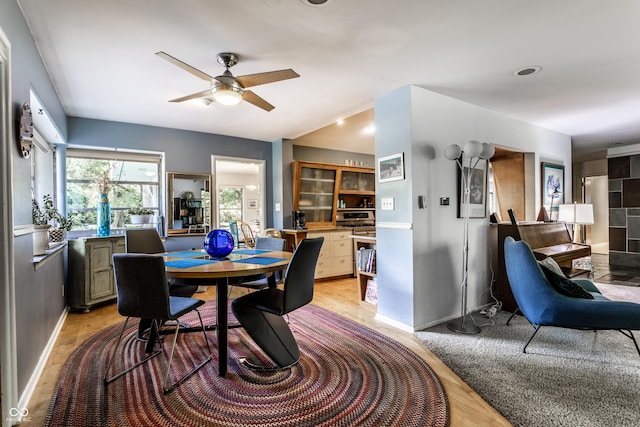 6220 Spring Mill Rd, Indianapolis, IN 46260 - dining room featuring light wood finished floors, ceiling fan, and baseboards
