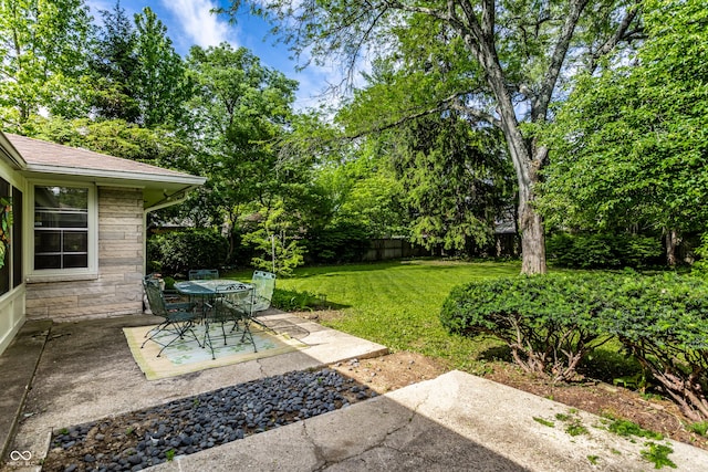 6220 Spring Mill Rd, Indianapolis, IN 46260 - view of yard featuring a patio and view of scattered trees