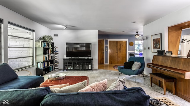 6220 Spring Mill Rd, Indianapolis, IN 46260 - living room featuring plenty of natural light, carpet flooring, and a ceiling fan