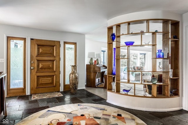 6220 Spring Mill Rd, Indianapolis, IN 46260 - foyer entrance with baseboards and stone tile floors