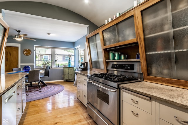 6220 Spring Mill Rd, Indianapolis, IN 46260 - kitchen with appliances with stainless steel finishes, light wood finished floors, lofted ceiling, white cabinets, and glass insert cabinets