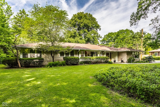 6220 Spring Mill Rd, Indianapolis, IN 46260 - ranch-style home with a front yard and a chimney
