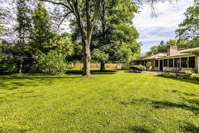 6220 Spring Mill Rd, Indianapolis, IN 46260 - view of yard featuring a sunroom and a patio