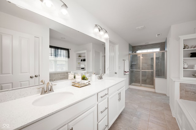 15580 Garrano Ln, Fishers, IN 46040 - bathroom with healthy amount of natural light, double vanity, a shower stall, and a garden tub