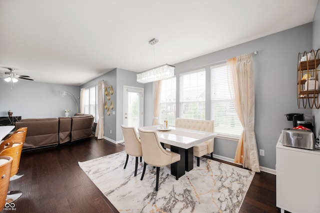 15580 Garrano Ln, Fishers, IN 46040 - dining space featuring hardwood / wood-style floors, baseboards, ceiling fan, and a chandelier