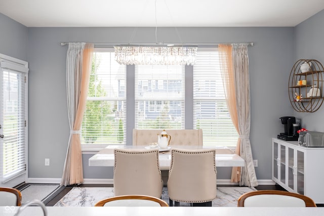 15580 Garrano Ln, Fishers, IN 46040 - dining area featuring a chandelier and baseboards