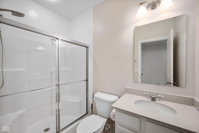 15580 Garrano Ln, Fishers, IN 46040 - bathroom featuring a shower with shower door, vanity, and toilet