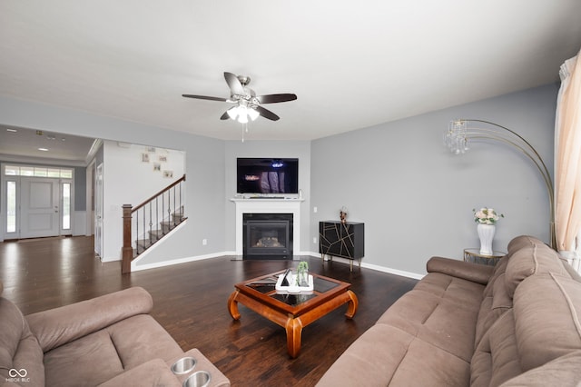 15580 Garrano Ln, Fishers, IN 46040 - living area with stairway, wood finished floors, baseboards, and a glass covered fireplace
