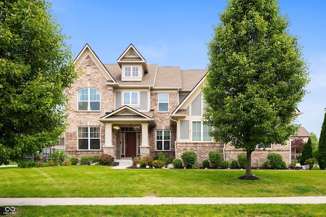 15580 Garrano Ln, Fishers, IN 46040 - craftsman-style house featuring a front lawn and brick siding