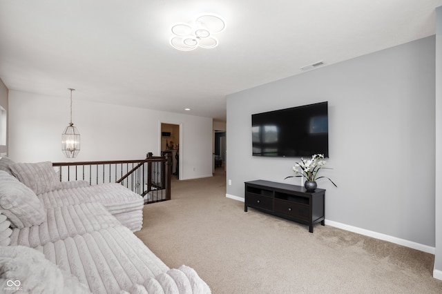 15580 Garrano Ln, Fishers, IN 46040 - living room featuring a chandelier, light carpet, and baseboards