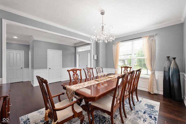 15580 Garrano Ln, Fishers, IN 46040 - dining room with wainscoting, dark wood-type flooring, a chandelier, and ornamental molding