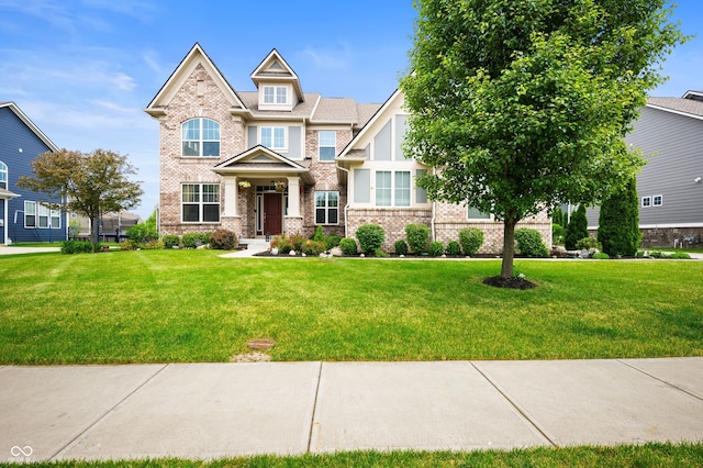 15580 Garrano Ln, Fishers, IN 46040 - craftsman-style home with a front yard and brick siding
