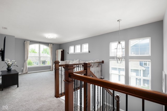 15580 Garrano Ln, Fishers, IN 46040 - corridor featuring an upstairs landing, healthy amount of natural light, carpet, and baseboards
