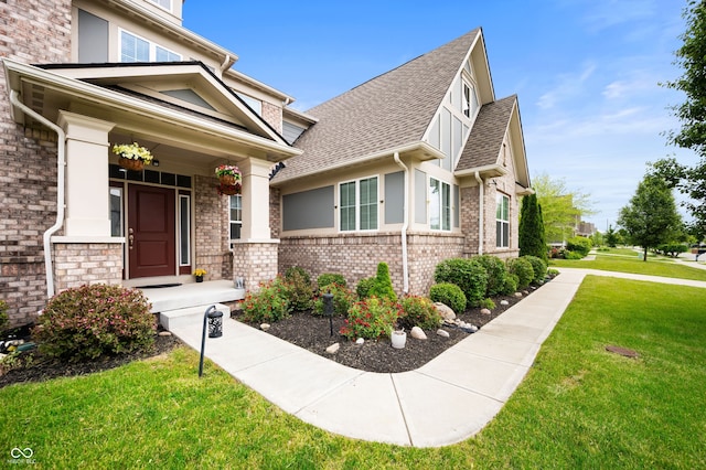 15580 Garrano Ln, Fishers, IN 46040 - view of front of home featuring a front lawn, a shingled roof, and brick siding
