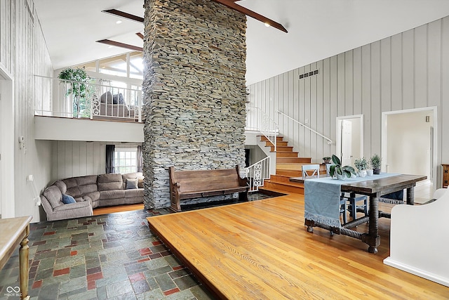 6605 Grosvenor Pl, Indianapolis, IN 46220 - living area with high vaulted ceiling and stairway