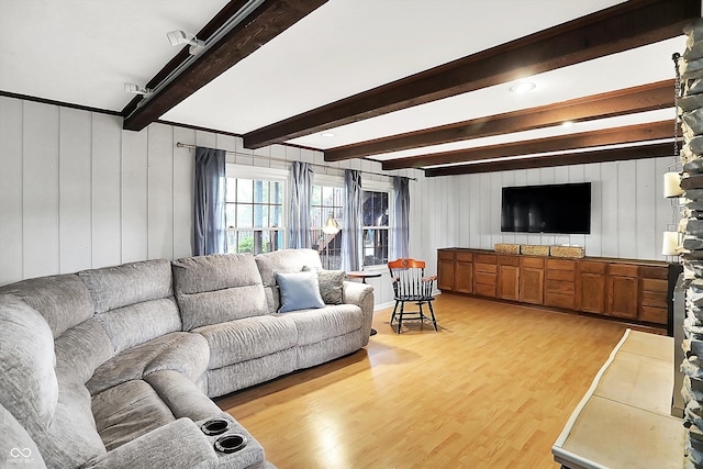 6605 Grosvenor Pl, Indianapolis, IN 46220 - living room with light wood finished floors and beamed ceiling