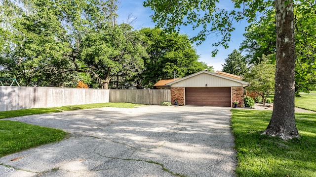 7110 N Layman Ave, Indianapolis, IN 46250 - exterior space with asphalt driveway and brick siding