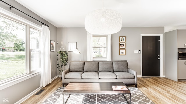 7110 N Layman Ave, Indianapolis, IN 46250 - living area featuring light wood-style flooring and baseboards
