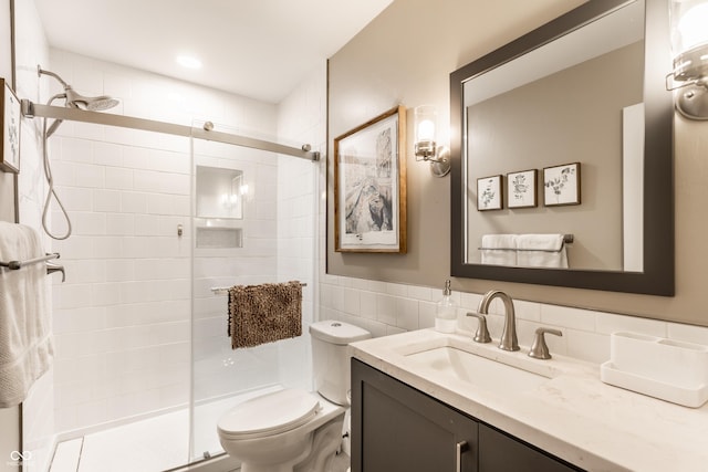 7110 N Layman Ave, Indianapolis, IN 46250 - full bath with a shower stall, toilet, vanity, and tile walls