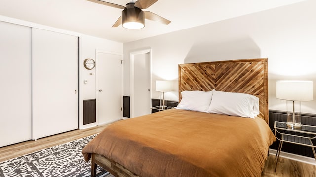 7110 N Layman Ave, Indianapolis, IN 46250 - bedroom featuring wood finished floors, a ceiling fan, and a closet