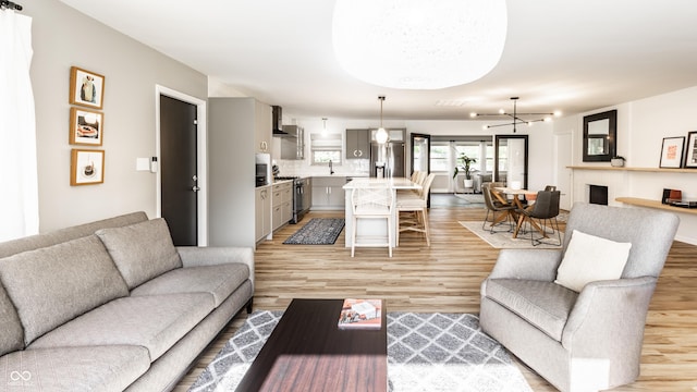 7110 N Layman Ave, Indianapolis, IN 46250 - living room featuring light wood-type flooring