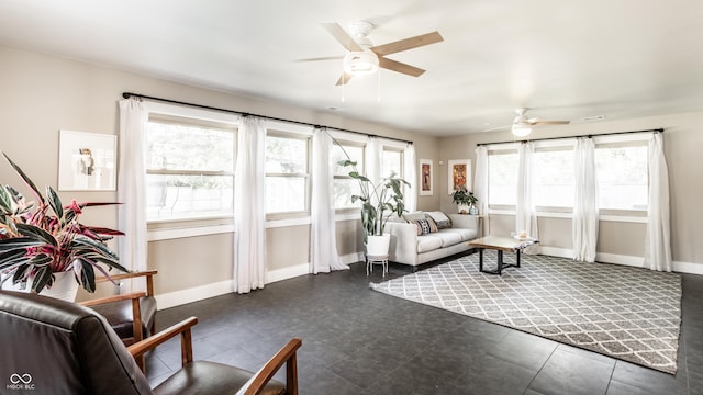 7110 N Layman Ave, Indianapolis, IN 46250 - living area with ceiling fan and baseboards