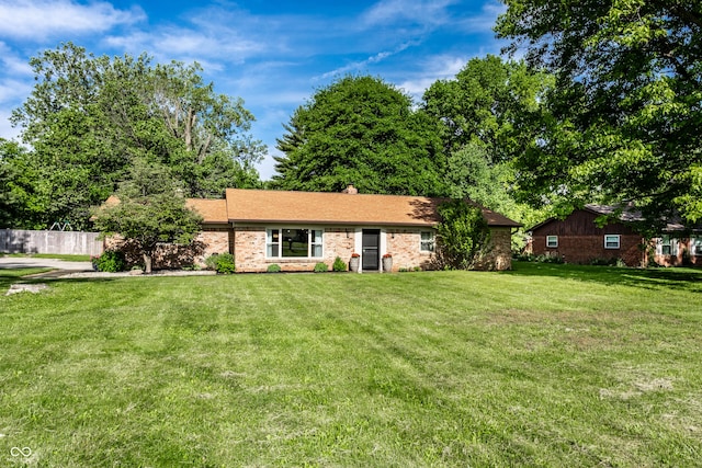 7110 N Layman Ave, Indianapolis, IN 46250 - single story home with a front yard and brick siding