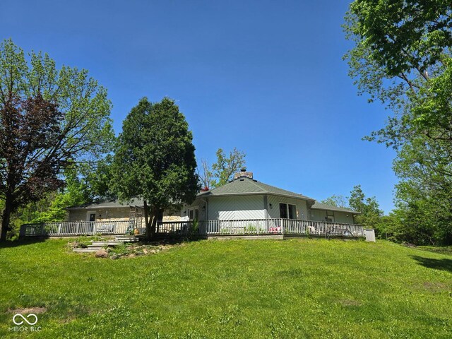 4115 Tansel Rd, Indianapolis, IN 46234 - back of property with a lawn and a chimney