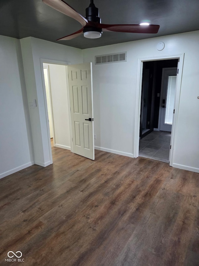 4115 Tansel Rd, Indianapolis, IN 46234 - empty room featuring ceiling fan, baseboards, and dark wood-type flooring