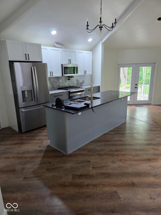 4115 Tansel Rd, Indianapolis, IN 46234 - kitchen featuring stainless steel appliances, a sink, tasteful backsplash, dark wood finished floors, and recessed lighting