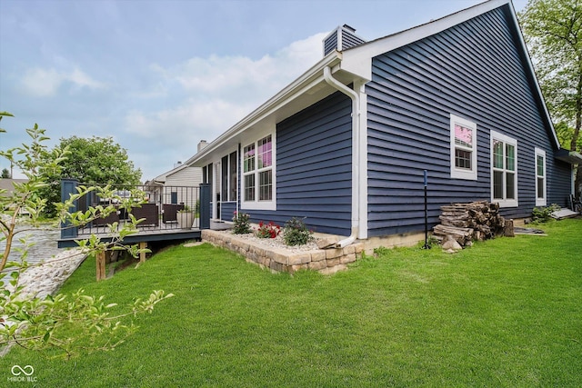 7838 Chesapeake Dr E, Indianapolis, IN 46236 - view of side of property featuring a wooden deck, a chimney, and a lawn