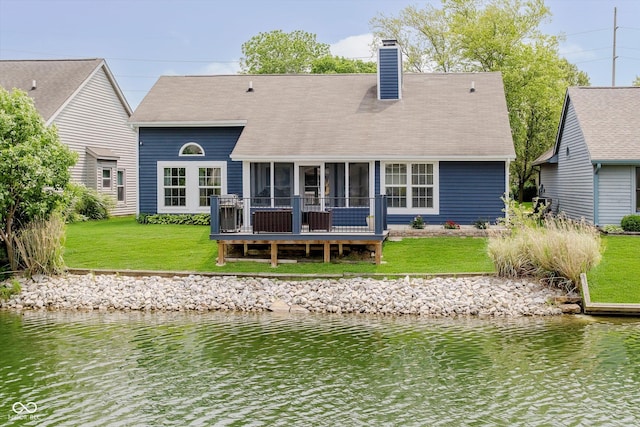 7838 Chesapeake Dr E, Indianapolis, IN 46236 - rear view of property featuring a yard, a sunroom, a chimney, a water view, and a shingled roof
