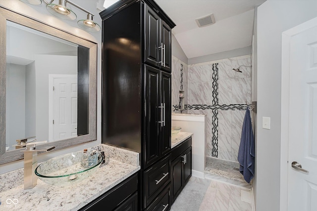 7838 Chesapeake Dr E, Indianapolis, IN 46236 - bathroom featuring vanity, a tile shower, and lofted ceiling