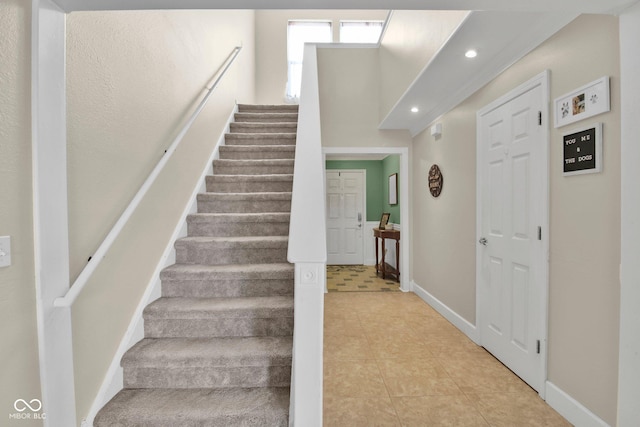 2829 Beachwalk Ln, Kokomo, IN 46902 - stairs featuring baseboards, recessed lighting, and tile patterned floors