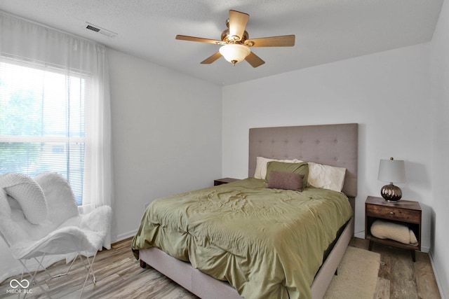 2829 Beachwalk Ln, Kokomo, IN 46902 - bedroom featuring wood finished floors, a ceiling fan, and baseboards