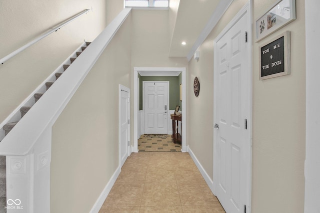 2829 Beachwalk Ln, Kokomo, IN 46902 - hallway with light tile patterned floors, baseboards, stairway, and recessed lighting