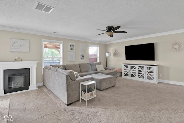 2829 Beachwalk Ln, Kokomo, IN 46902 - living room featuring crown molding, a glass covered fireplace, ceiling fan, a textured ceiling, and baseboards