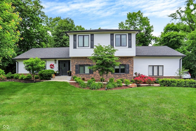 7255 Haverhill Ct, Indianapolis, IN 46250 - split level home with brick siding, a front lawn, and a shingled roof