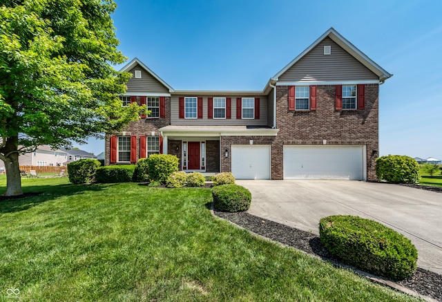2209 S Logan Dr, New Palestine, IN 46163 - view of front of house with a garage, concrete driveway, brick siding, and a front yard