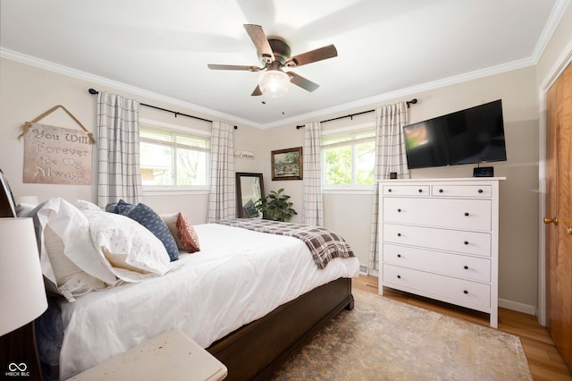 9104 W Lone Beech Dr, Muncie, IN 47304 - bedroom featuring ornamental molding, wood finished floors, baseboards, and a ceiling fan