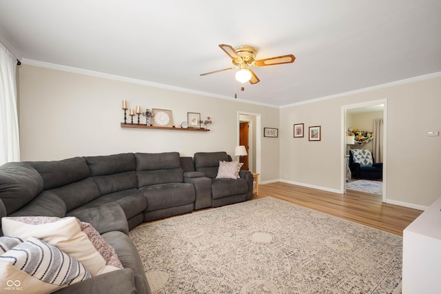 9104 W Lone Beech Dr, Muncie, IN 47304 - living room featuring wood finished floors, ceiling fan, ornamental molding, and baseboards