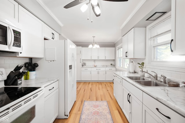 9104 W Lone Beech Dr, Muncie, IN 47304 - kitchen featuring white appliances, a sink, ornamental molding, backsplash, and white cabinetry