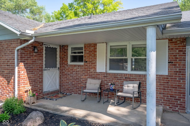 9104 W Lone Beech Dr, Muncie, IN 47304 - property entrance with brick siding and a shingled roof