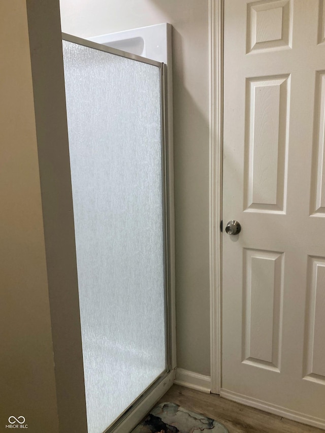 1114 N Olney St, Indianapolis, IN 46201 - bathroom with wood finished floors and baseboards
