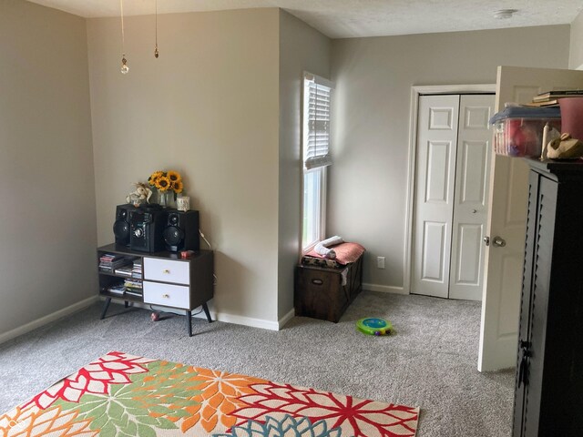1114 N Olney St, Indianapolis, IN 46201 - bedroom featuring light carpet, baseboards, and a closet