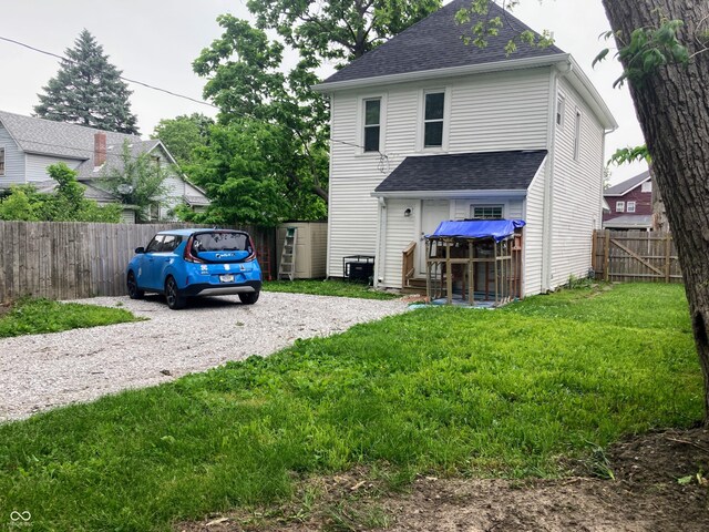 1114 N Olney St, Indianapolis, IN 46201 - rear view of property with gravel driveway and a shingled roof