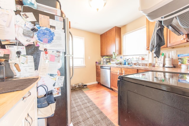 1913 Pennsylvania St, Columbus, IN 47201 - kitchen featuring appliances with stainless steel finishes, healthy amount of natural light, light wood-style flooring, and a sink