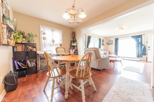 1913 Pennsylvania St, Columbus, IN 47201 - dining space featuring healthy amount of natural light, a chandelier, and wood finished floors