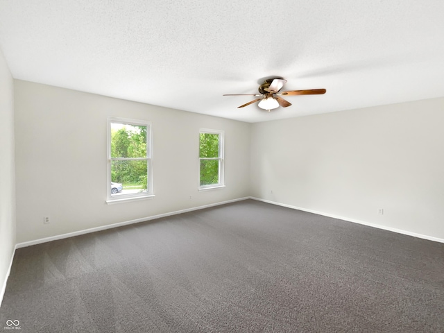 2116 Orchid Bloom Dr, Indianapolis, IN 46231 - spare room with ceiling fan, baseboards, and dark colored carpet