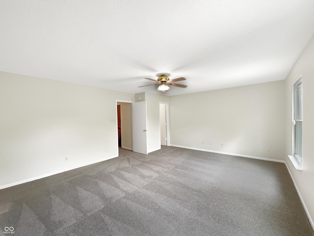 2116 Orchid Bloom Dr, Indianapolis, IN 46231 - empty room with ceiling fan, dark carpet, and baseboards